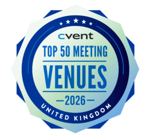 A circular blue and mint badge displaying Cvent Top 50 Meeting Venues 2026, United Kingdom with stars and decorative borders.